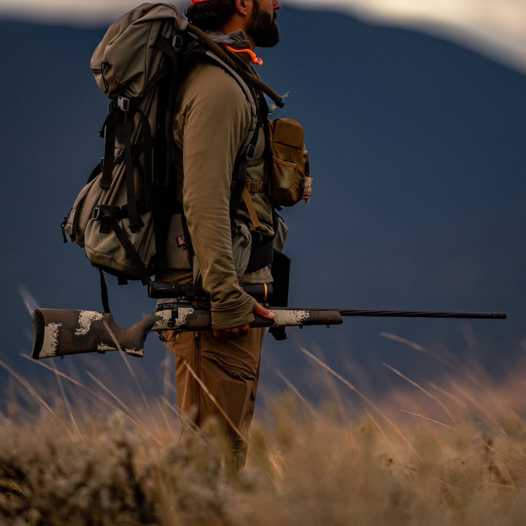 A Man Carrying a Gun