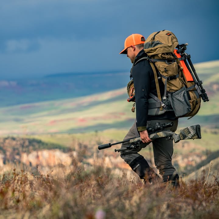 A Hunter Carrying Weatherby Mark