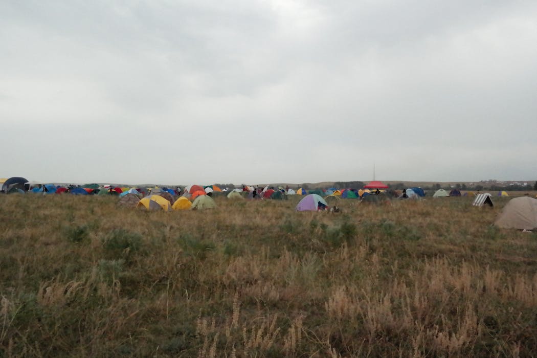 Campers in the Midwest Camping in Open Field