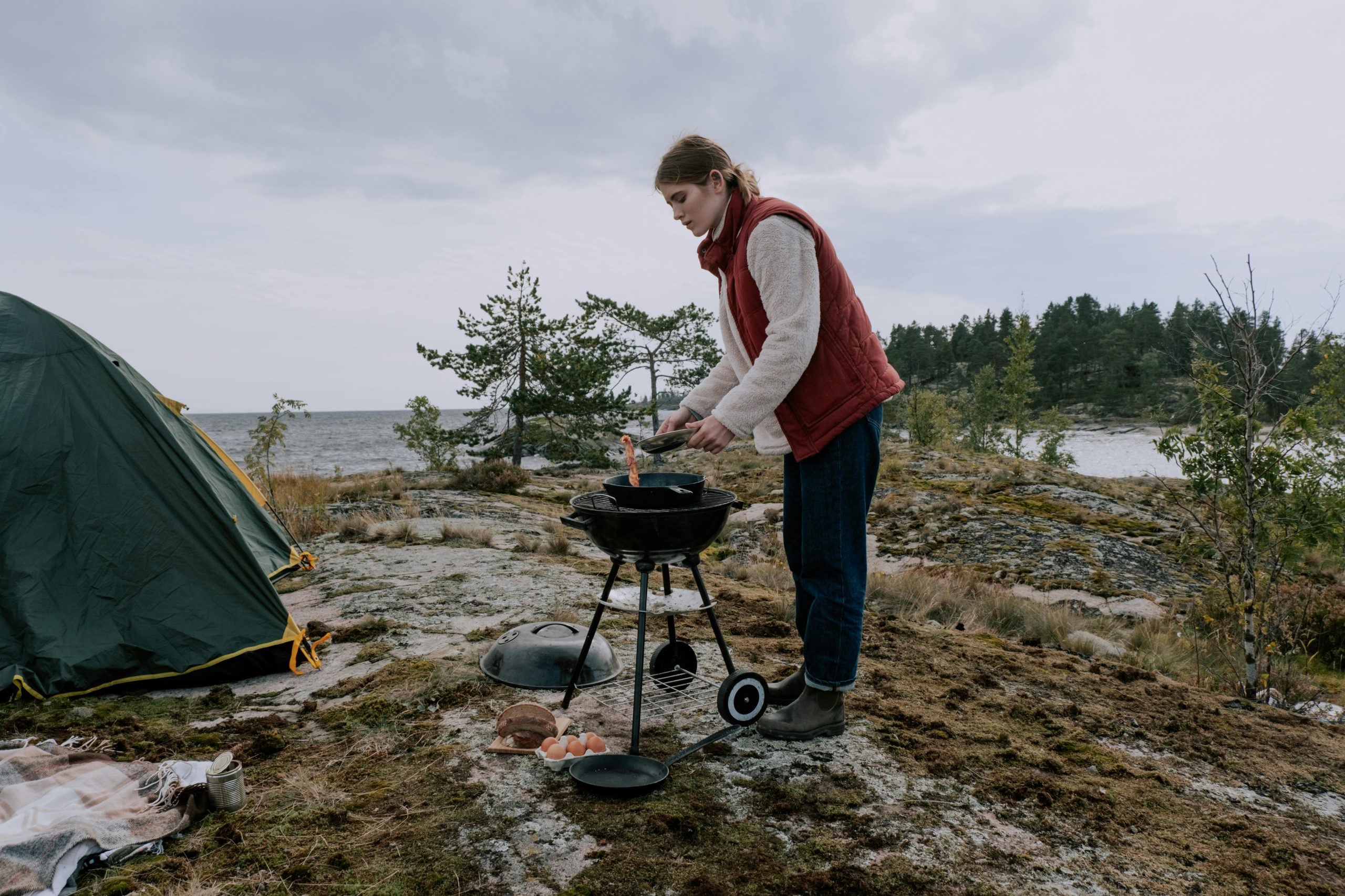A Person Using Portable Cooking Stove