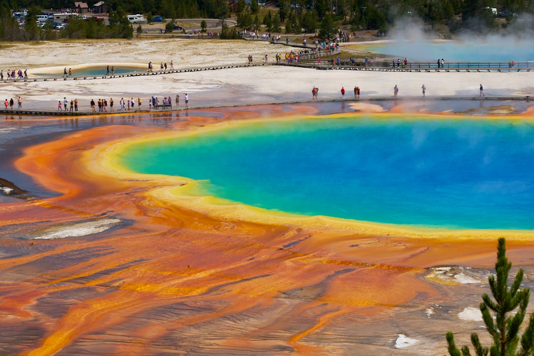 taiki-ishikawa-w6EMxsk8CDA-unsplash People at the Grand Prismatic Spring in Wyoming, United States