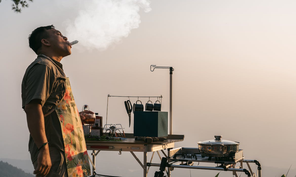 taiki-ishikawa-w6EMxsk8CDA-unsplash Man Smoking a Cigar and Cooking Outside