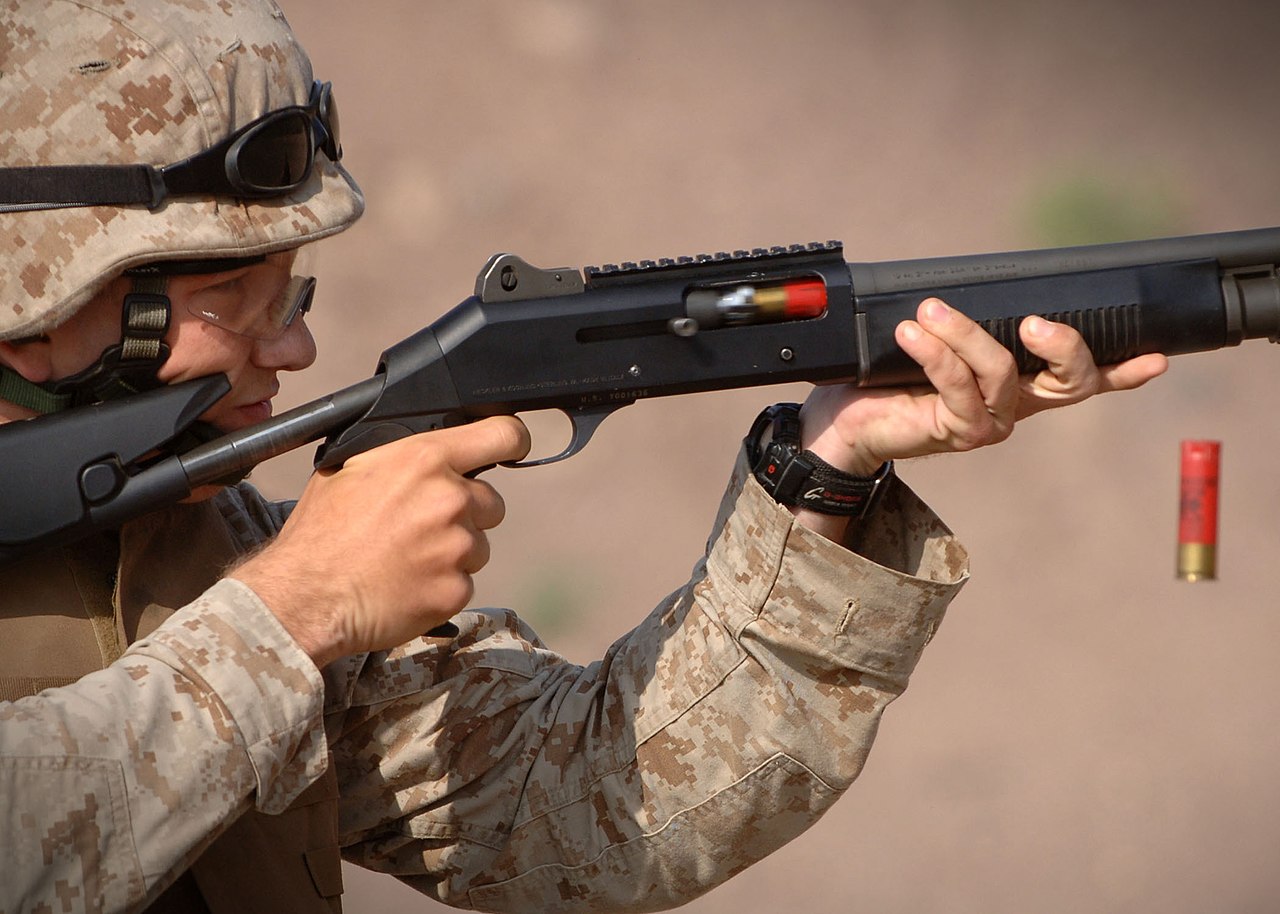 A U.S. Marine firing an M1014 shotgun as part of training in December 2006
