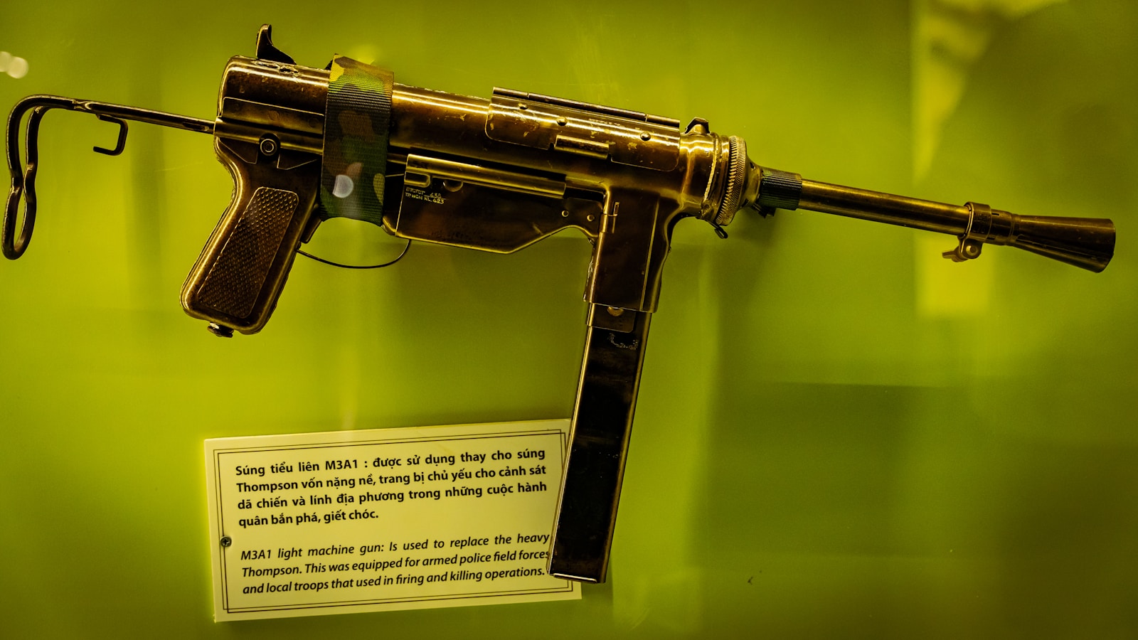 a replica of a gun on display in a museum