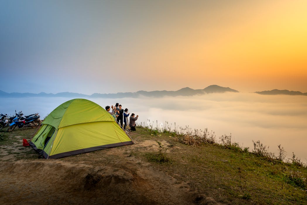 taiki-ishikawa-w6EMxsk8CDA-unsplash People Near Camping Tent Overlooking Sea of Clouds