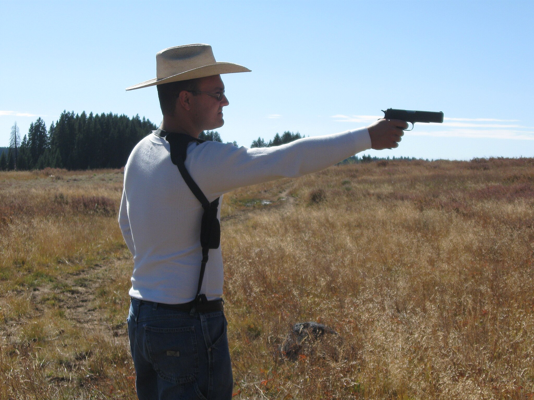 2048px-Shooting_a_1911A1_pistol_atop_Grand_Mesa,_Colorado