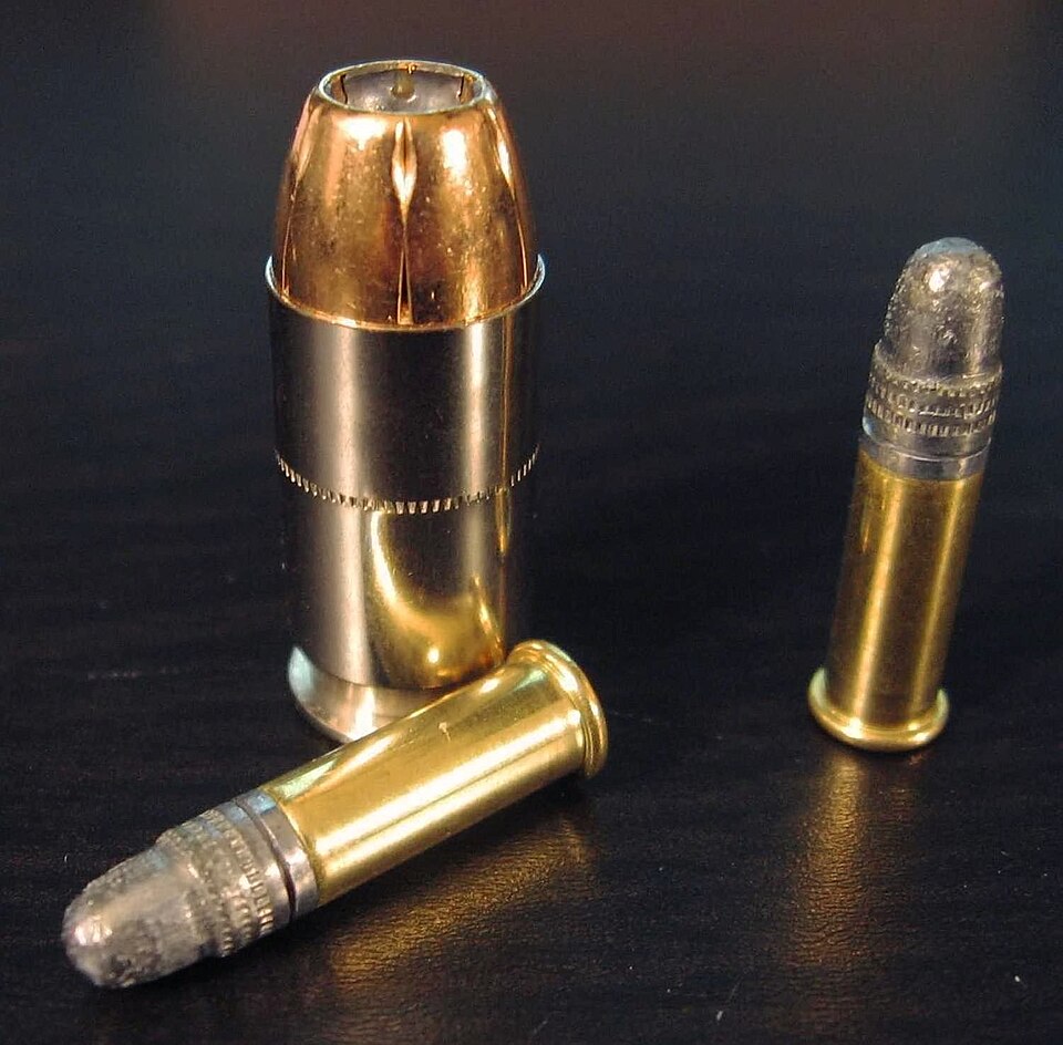 .22 LR rounds compared to a .45 ACP cartridge