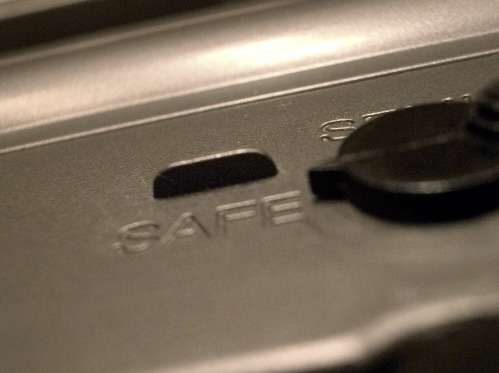 Close-up shot of a safety of an M16A2 rifle