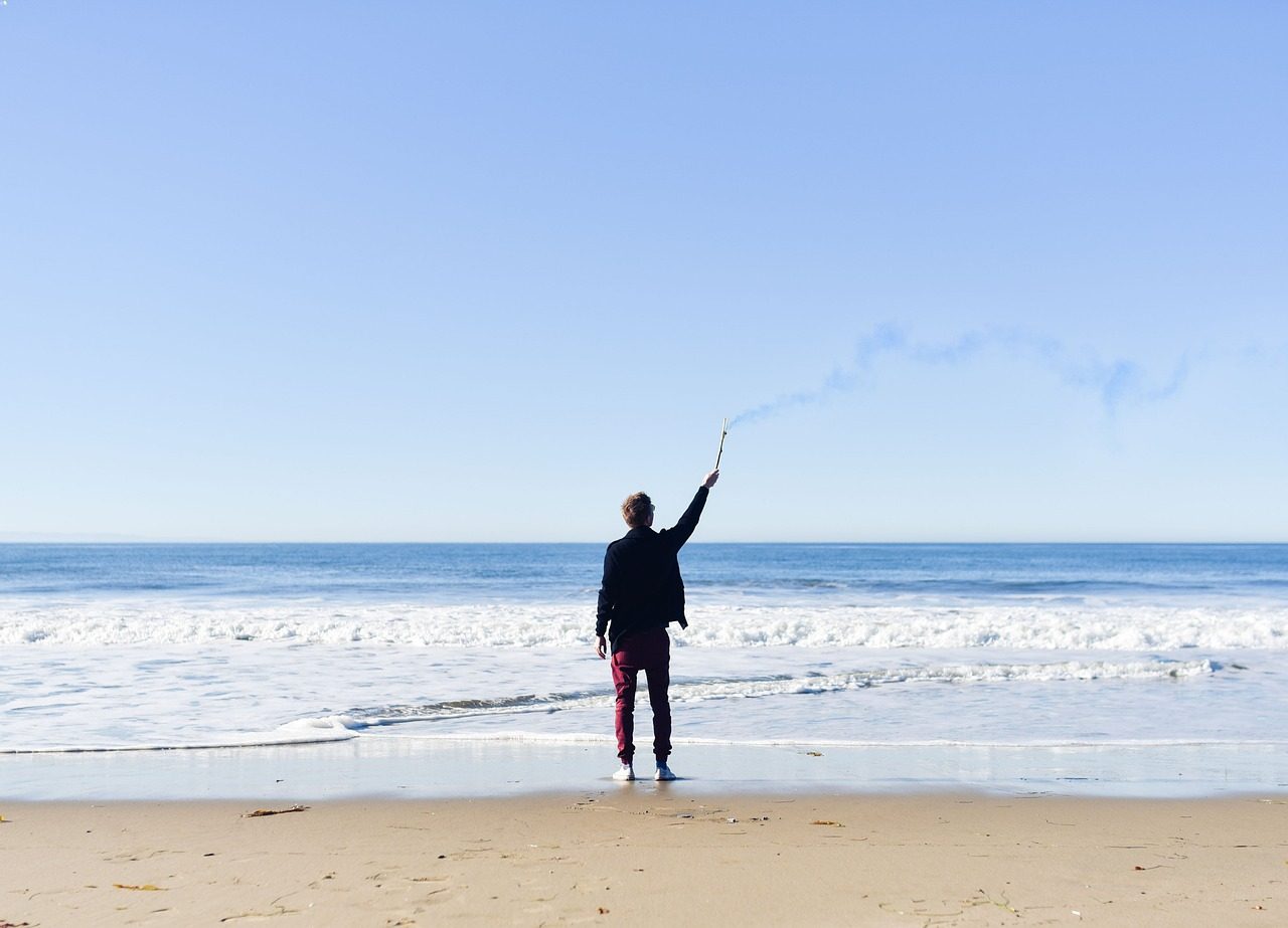 person, male, beach, lifestyle, man, torch, outdoors, sos, blue sky, nature, help, smoke, smoke signal, stick, guy, sand, waves, ocean, sea, shore, blue, sky, people, blue help, blue smoke, blue sand