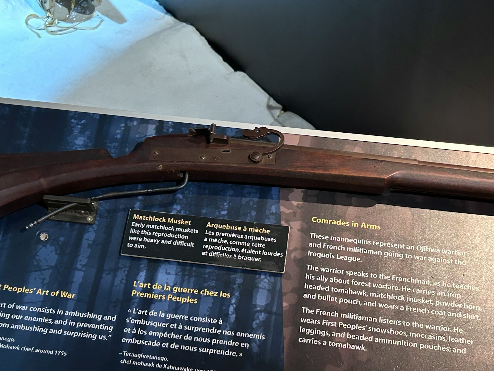 a rifle is on display in a museum