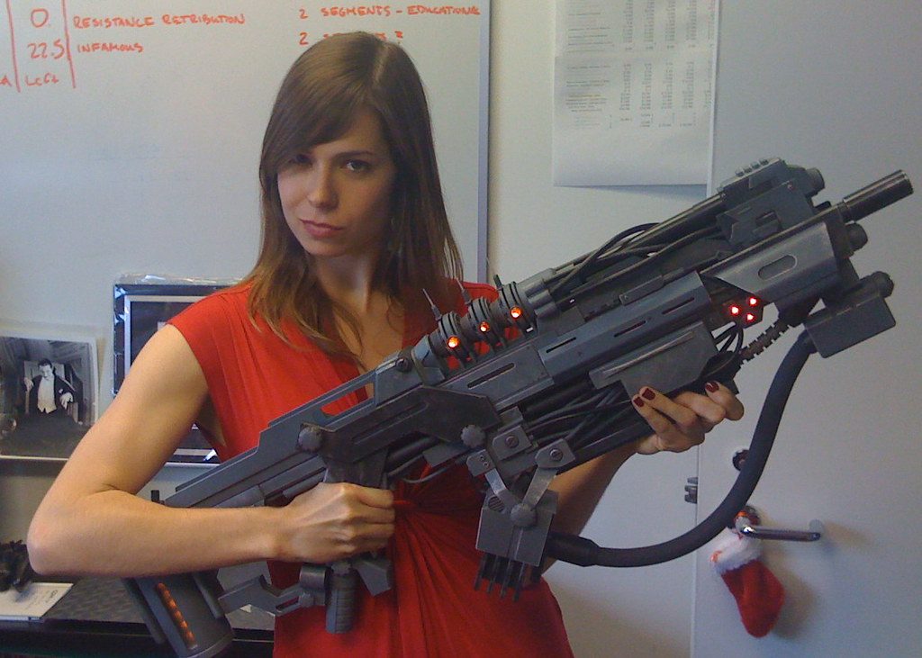 A Woman holding a gun