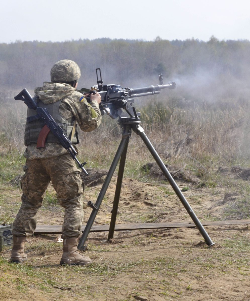 A soldier with the Ukrainian Land Forces fires a Degtyaryov-Shpagin Large-Caliber heavy machine gun