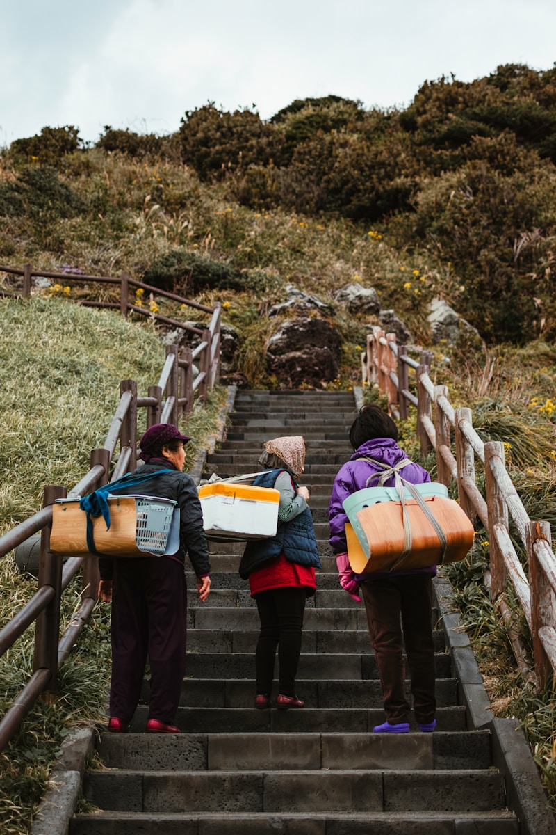 a group of people walking up a flight of stairs