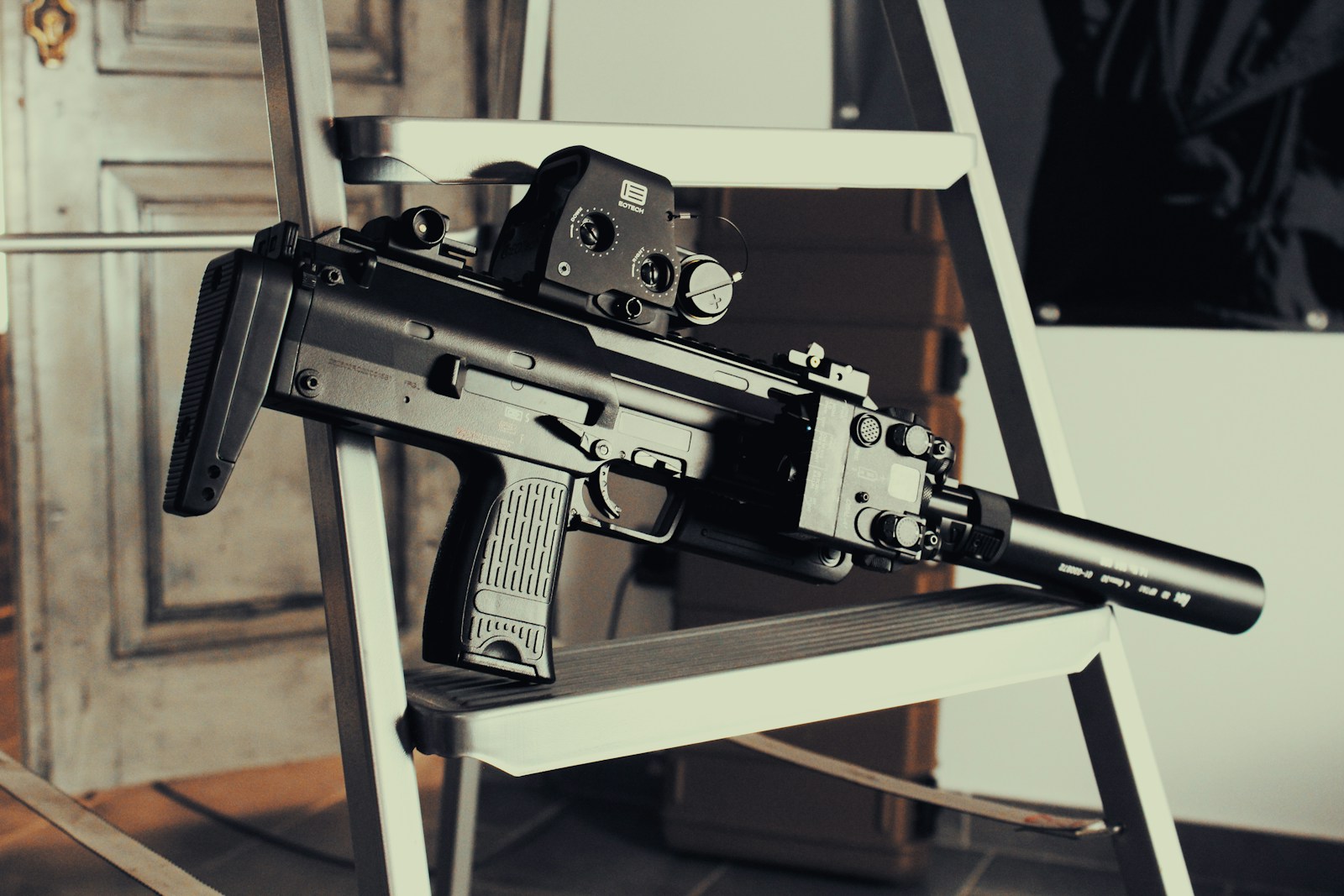 a machine gun sitting on top of a chair
